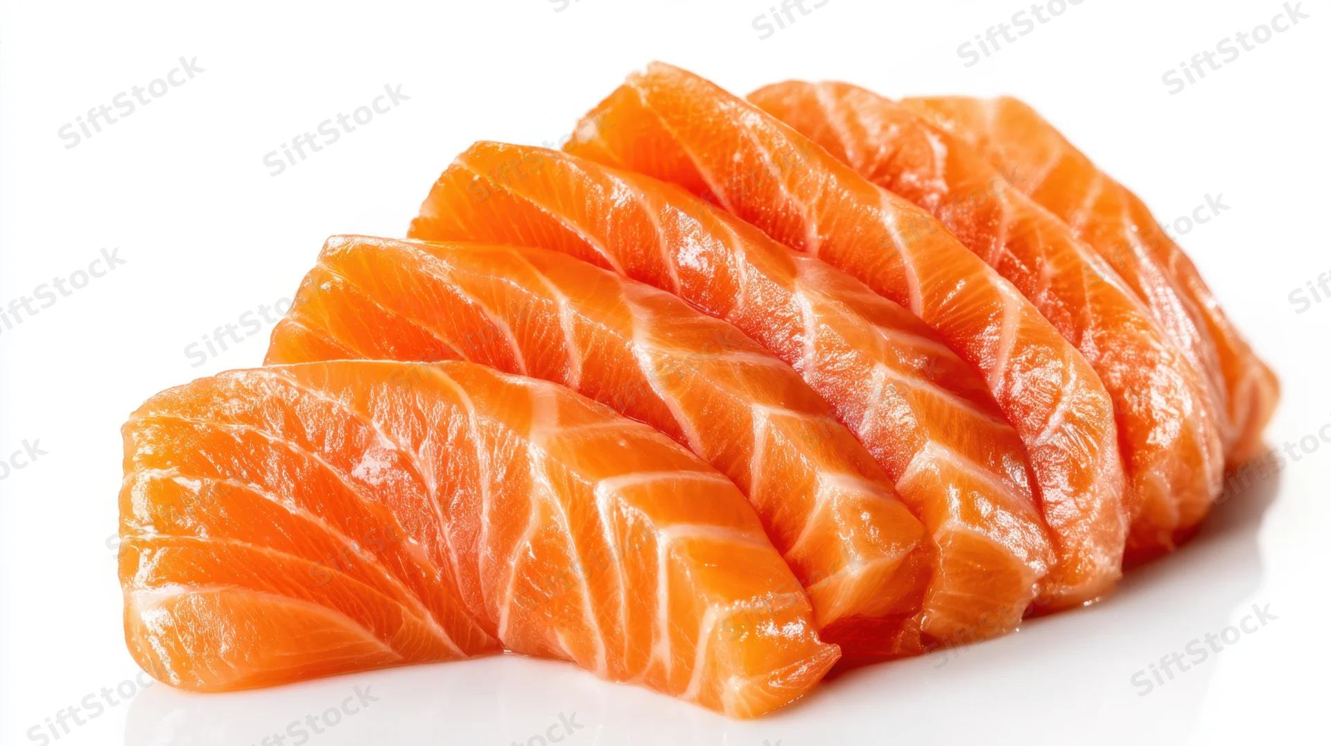 Neatly arranged slices of raw salmon sashimi on white background