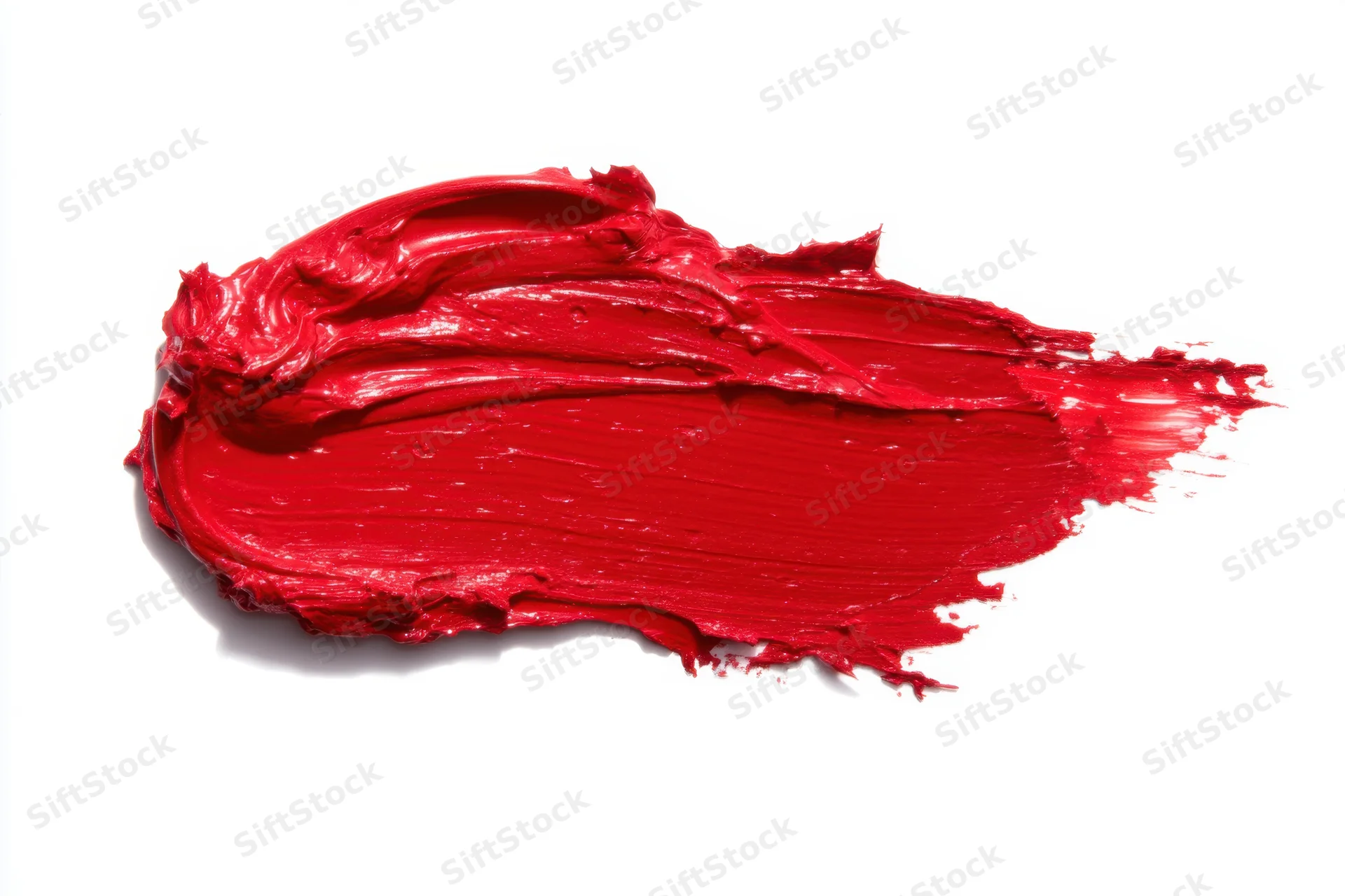 Bold red paint stroke smeared across white background