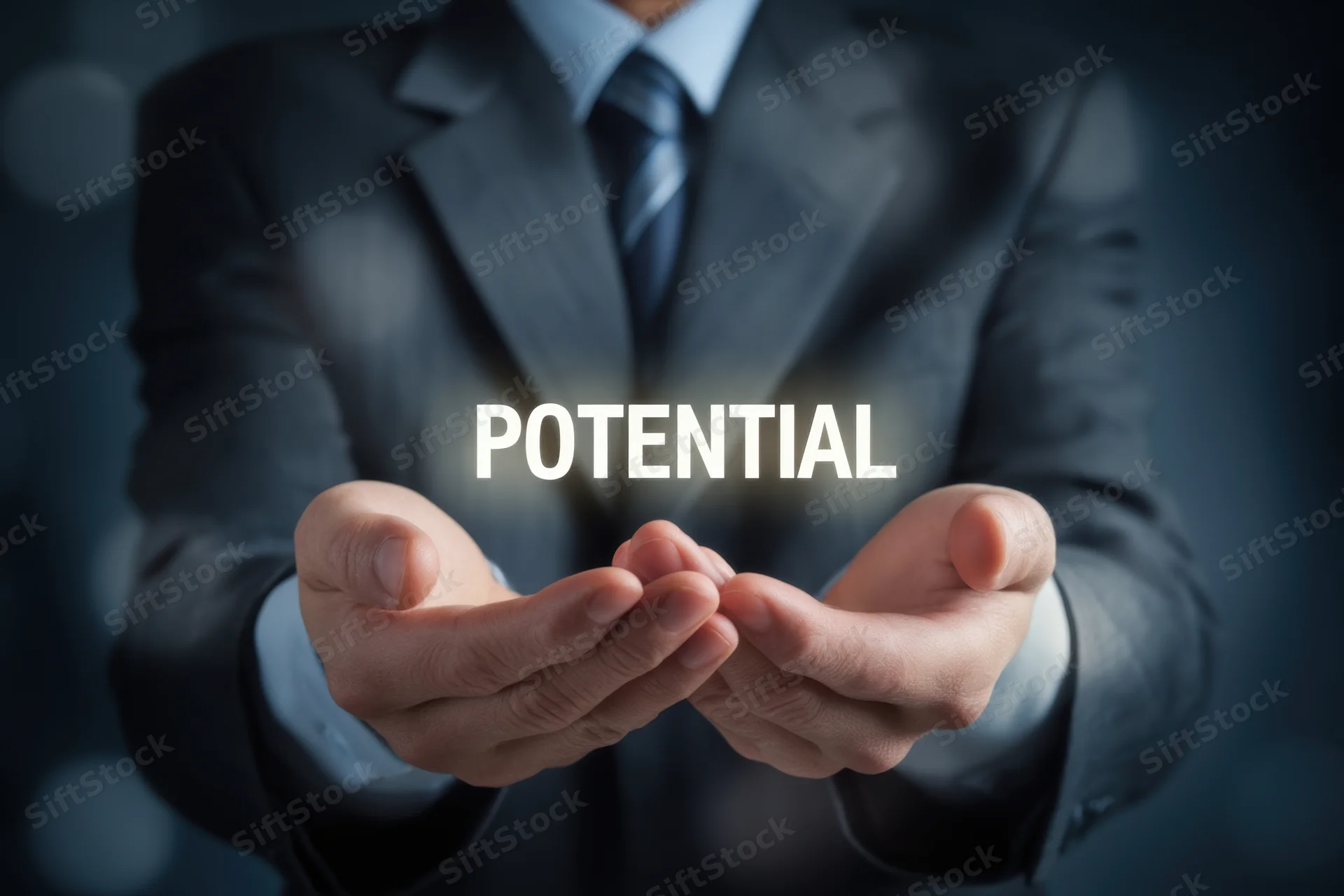 Businessman in suit holding hands out with floating text potential
