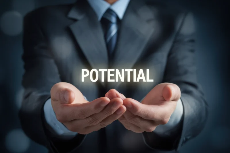 Businessman in suit holding hands out with floating text potential