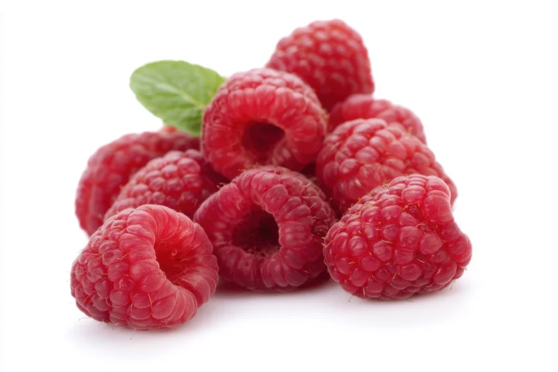Cluster of fresh plump raspberries with a mint leaf on white background