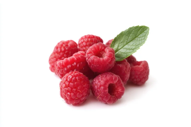 Cluster of fresh plump raspberries with a mint leaf on white background