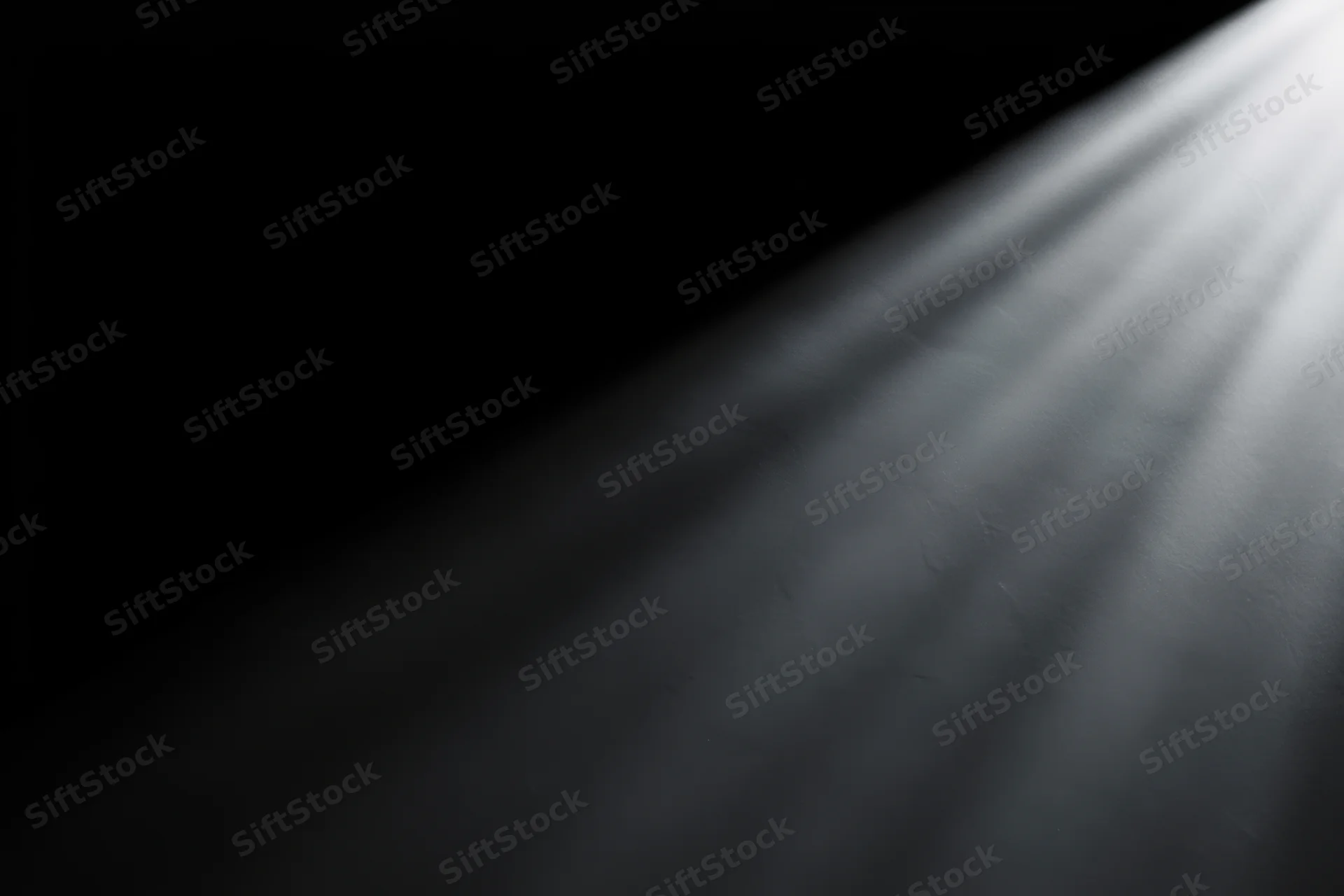Focused beam of light cutting through dark space