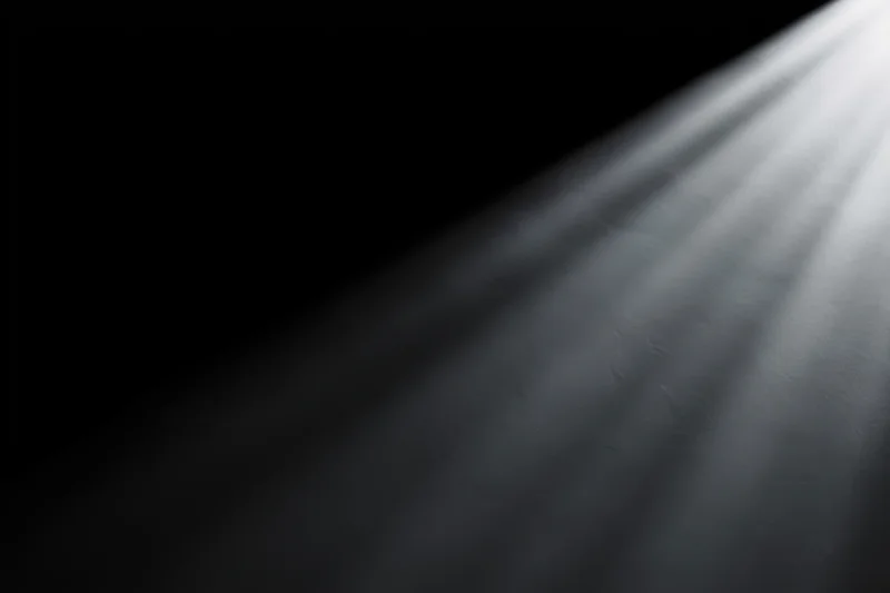 Focused beam of light cutting through dark space
