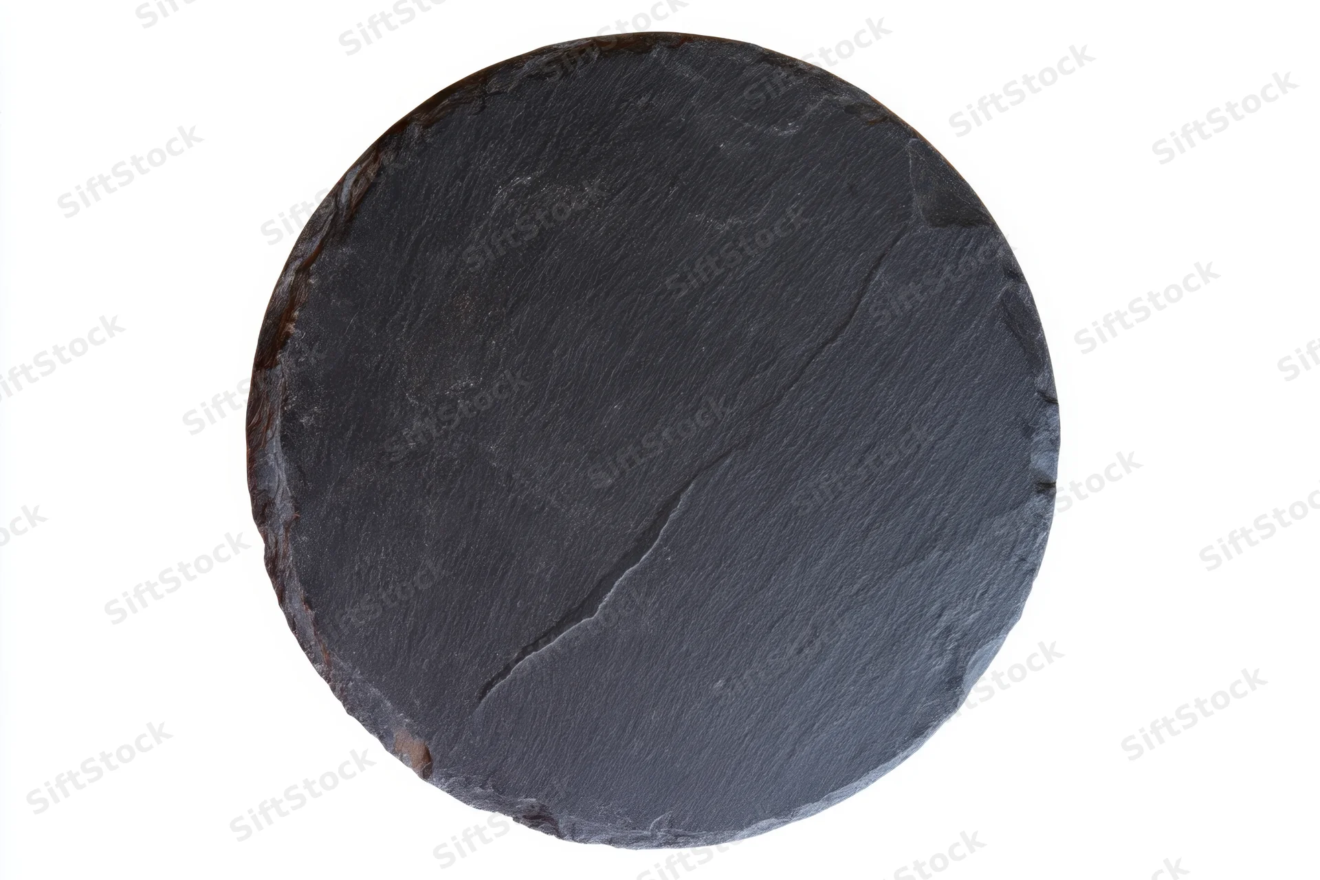 Round black slate serving plate with textured rustic surface isolated on white