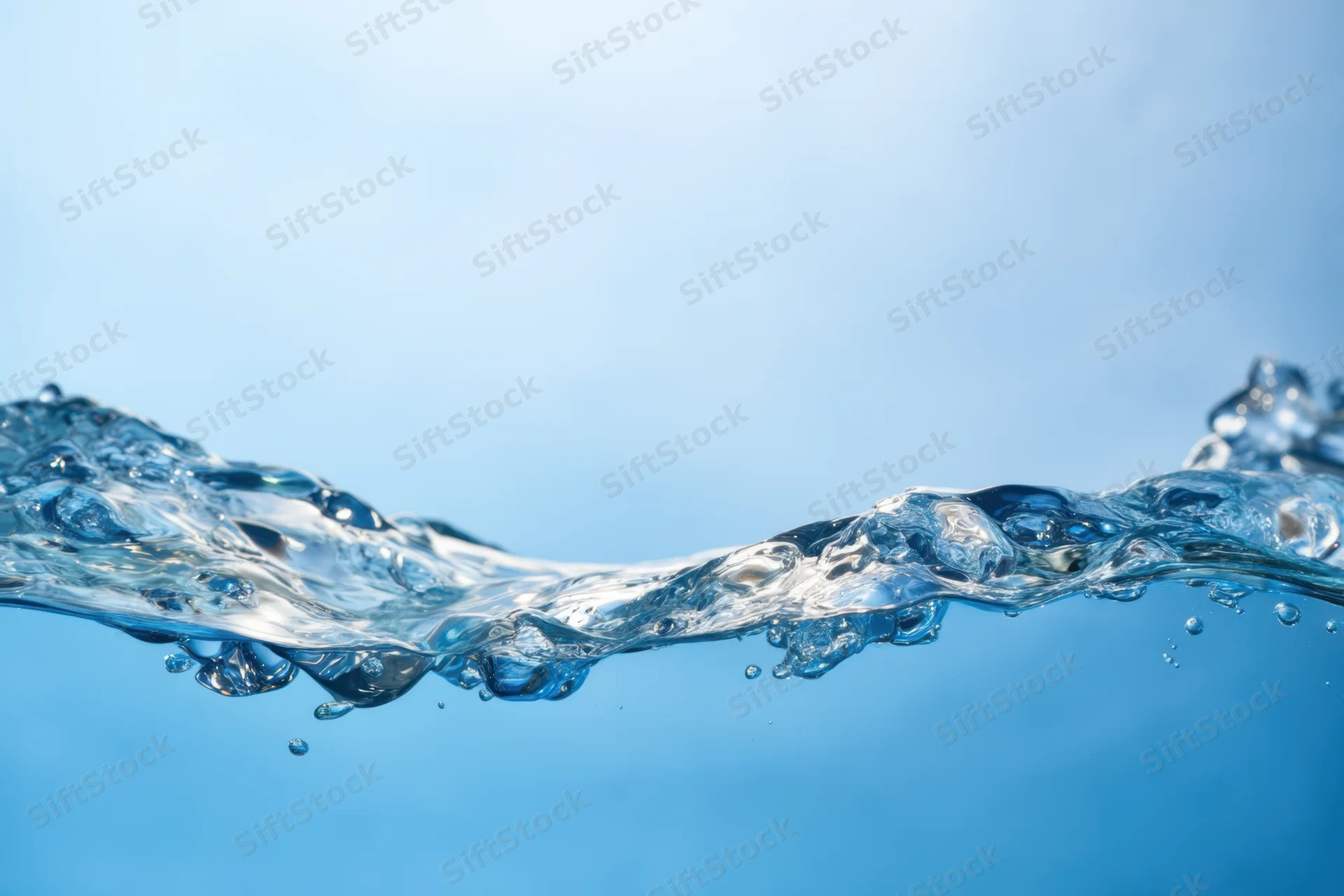 Clear blue water surface with gentle ripples and bubbles against a light blue background