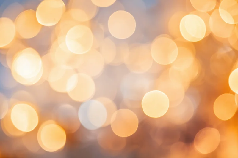 Warm glowing bokeh lights arranged in soft blur as background