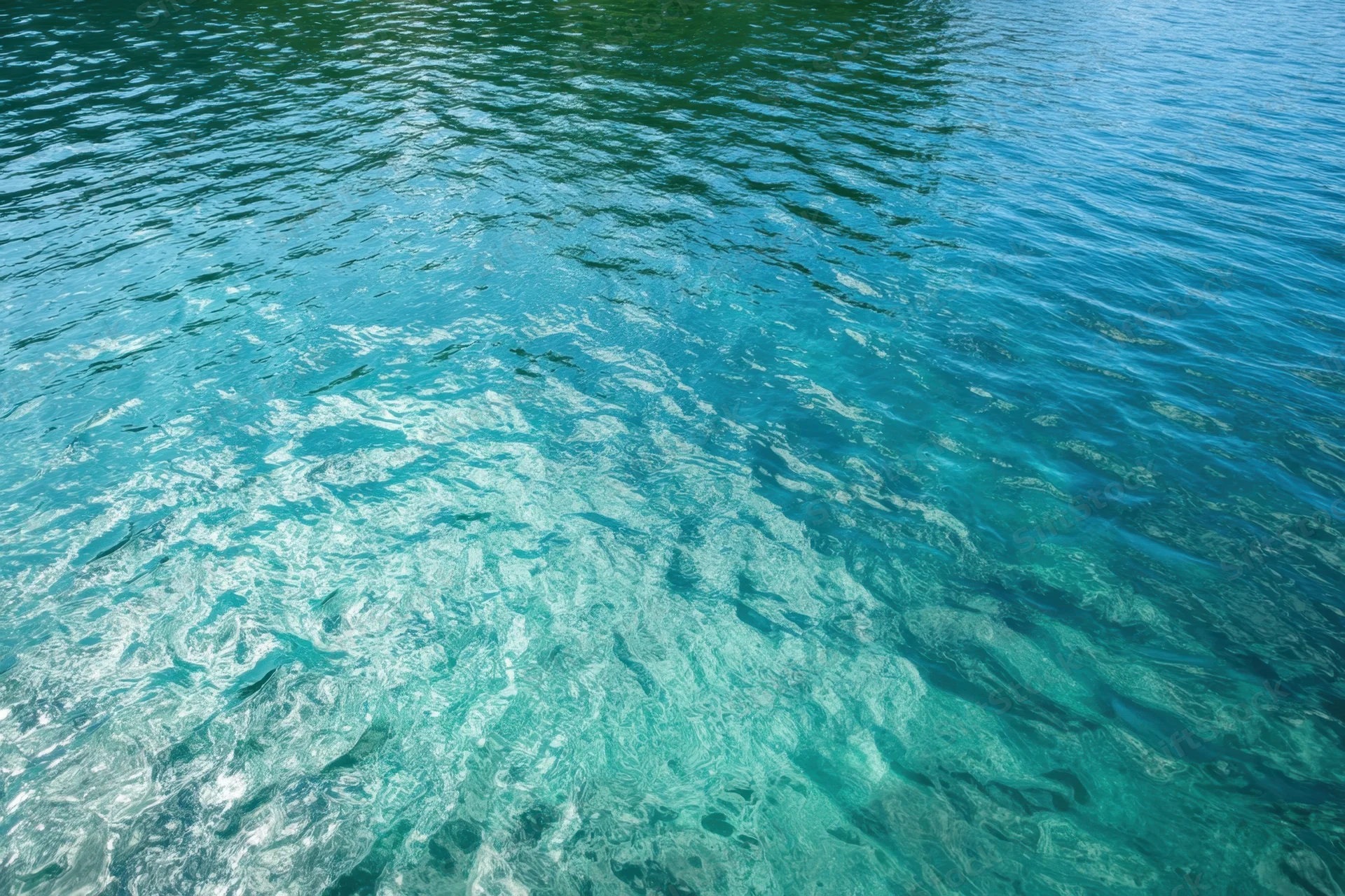 Turquoise water with gentle ripples and reflections on the surface