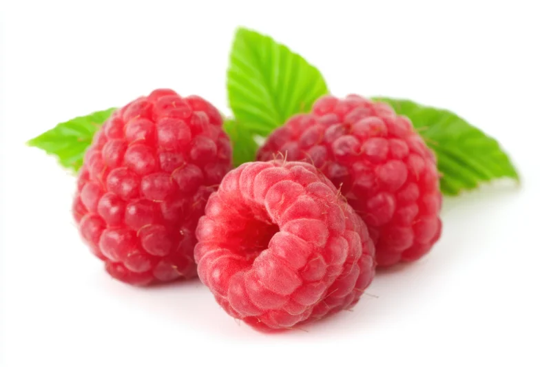 Three plump red raspberries with green leaves on white background