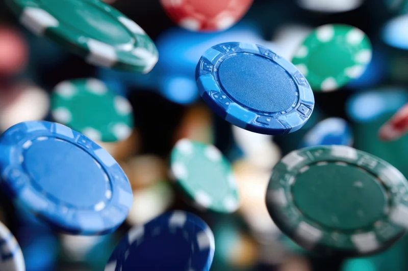 Flying poker chips in midair during a casino game