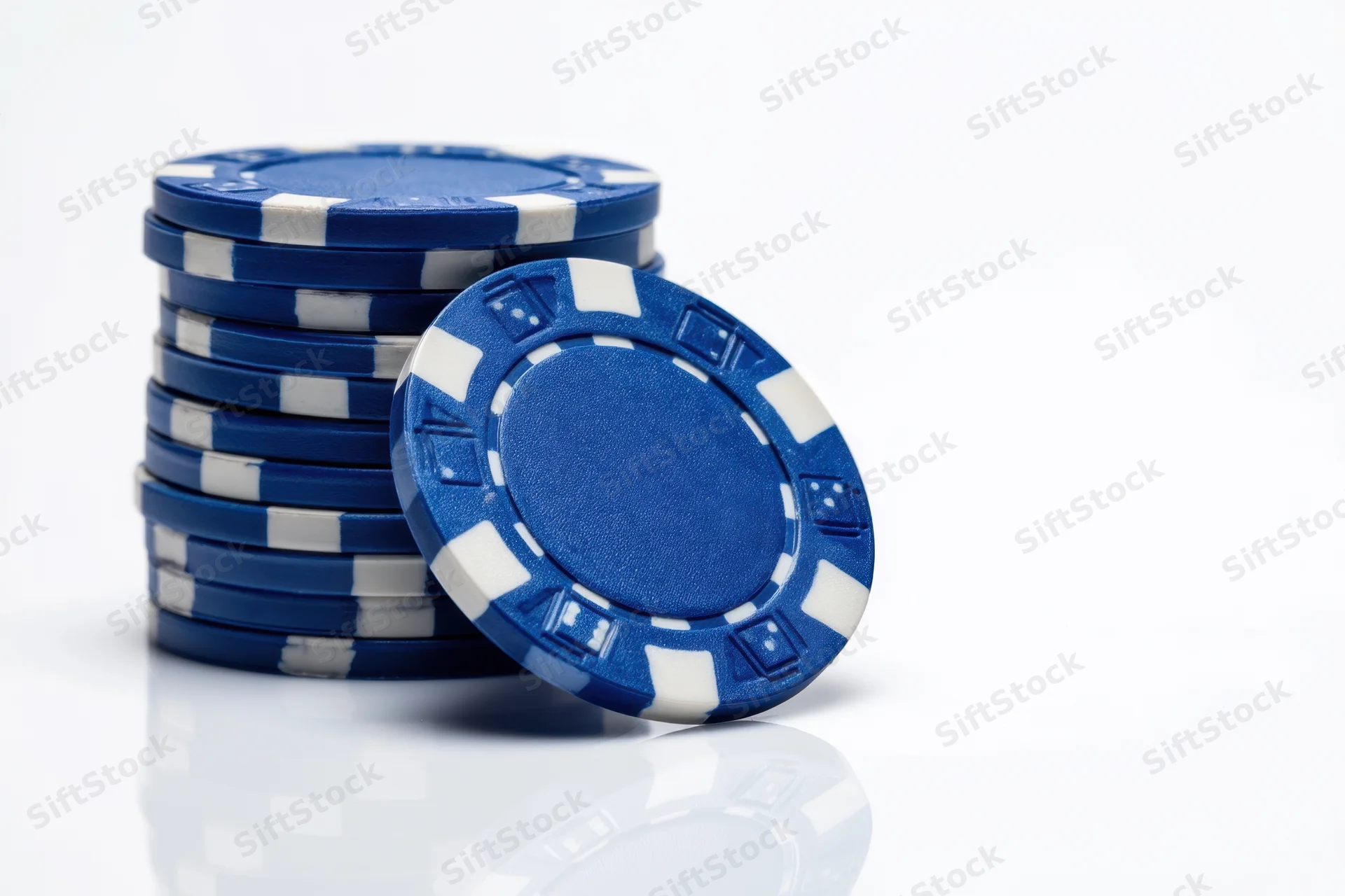 Stack of blue poker chips with white stripes on white background