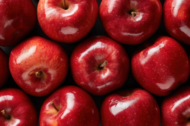 Red apples arranged closely together in a top-down view