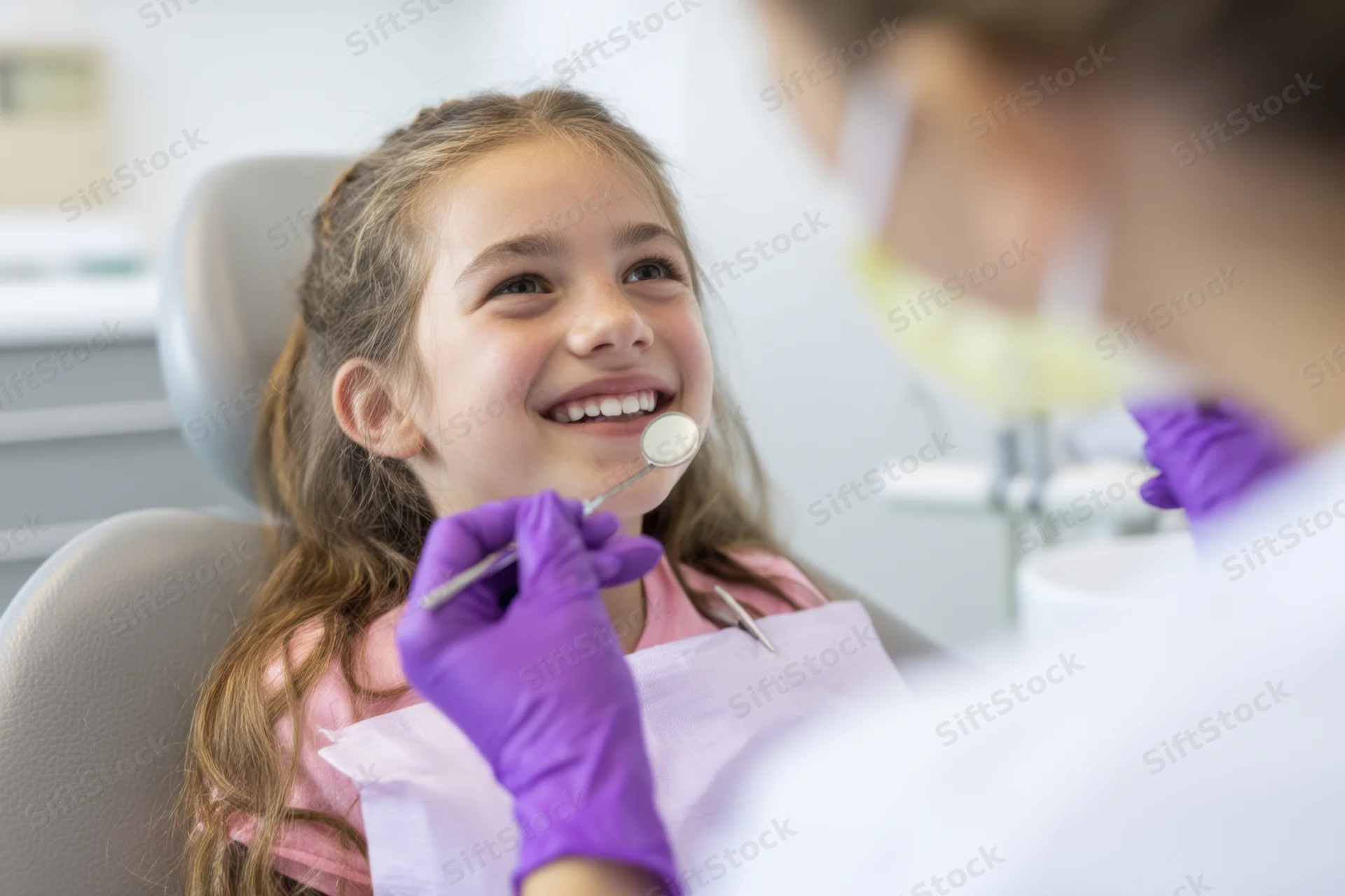 Young girl smiling during dental examination in a dental clinic