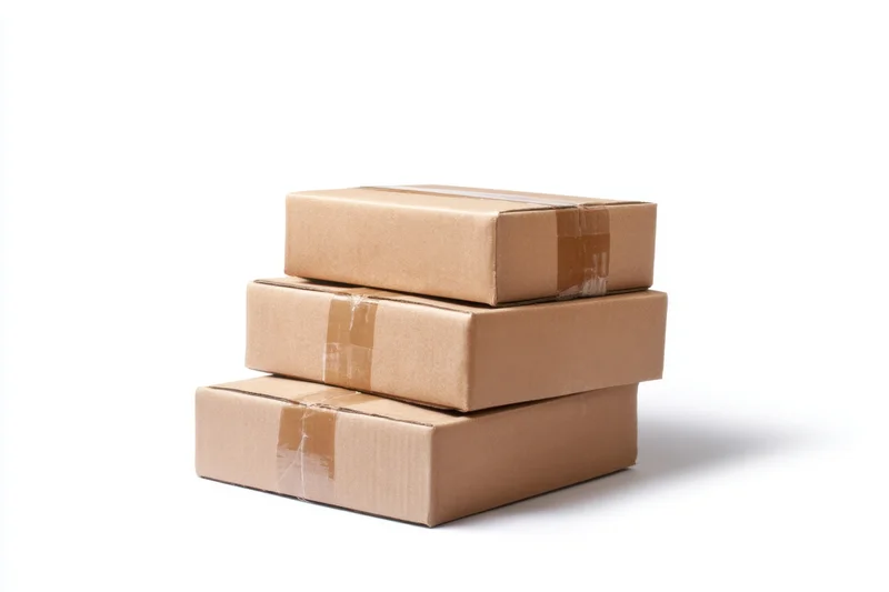 Three brown cardboard boxes stacked on a white background