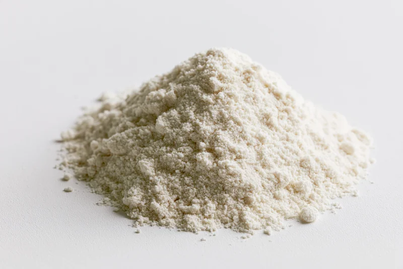Small mound of fine white powder likely flour or milk powder