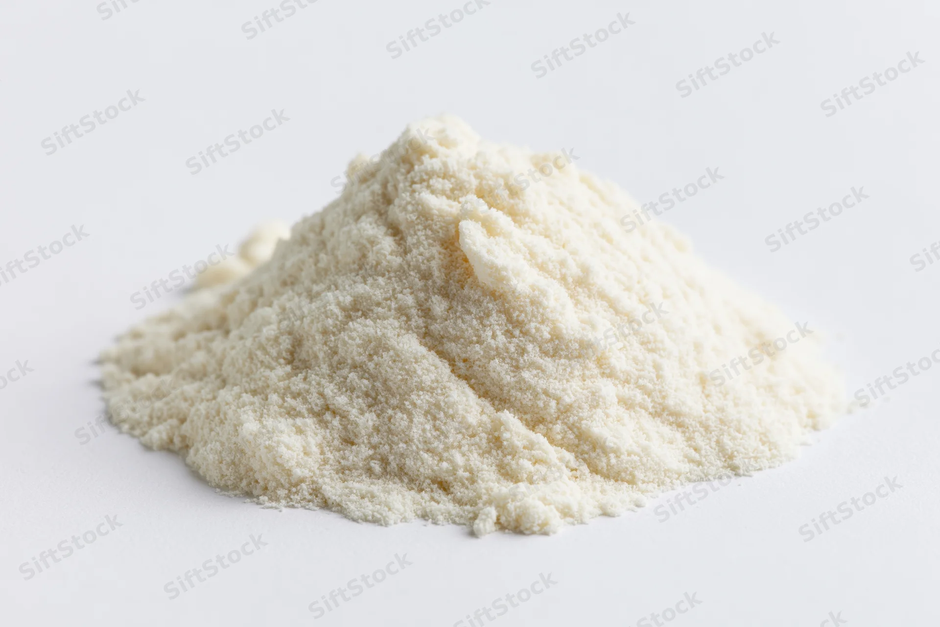 A mound of fine white powder on a plain white surface