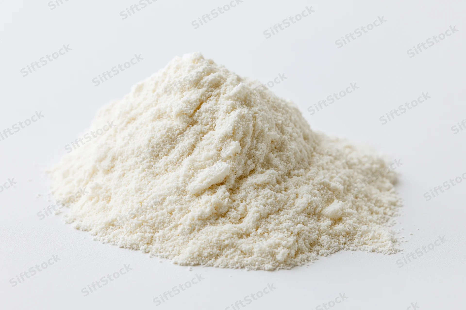 Small mound of fine white powder on plain white surface