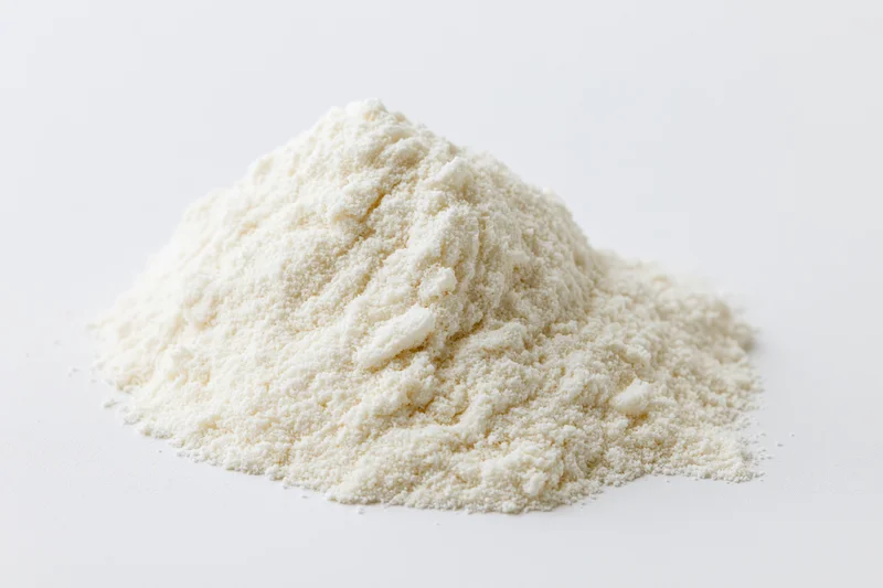 Small mound of fine white powder on plain white surface