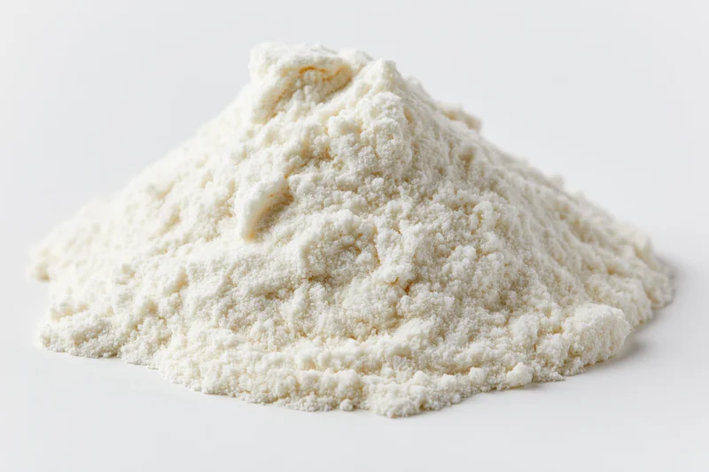 A mound of fine white powder arranged on a plain white surface