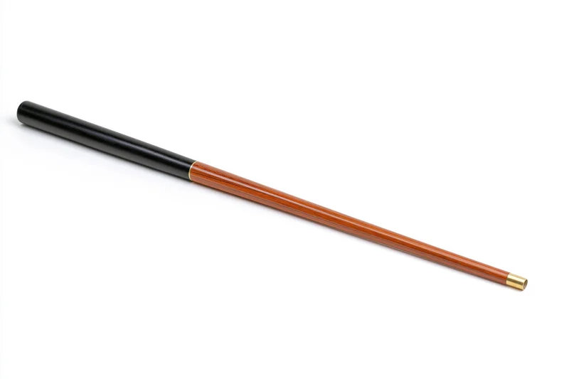 Two-piece snooker cue laid diagonally on white background with black handle and wooden shaft featuring brass tip