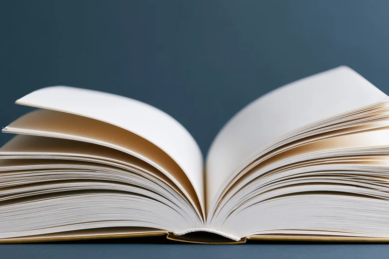 Open hardcover book with pages fanned wide on dark blue surface