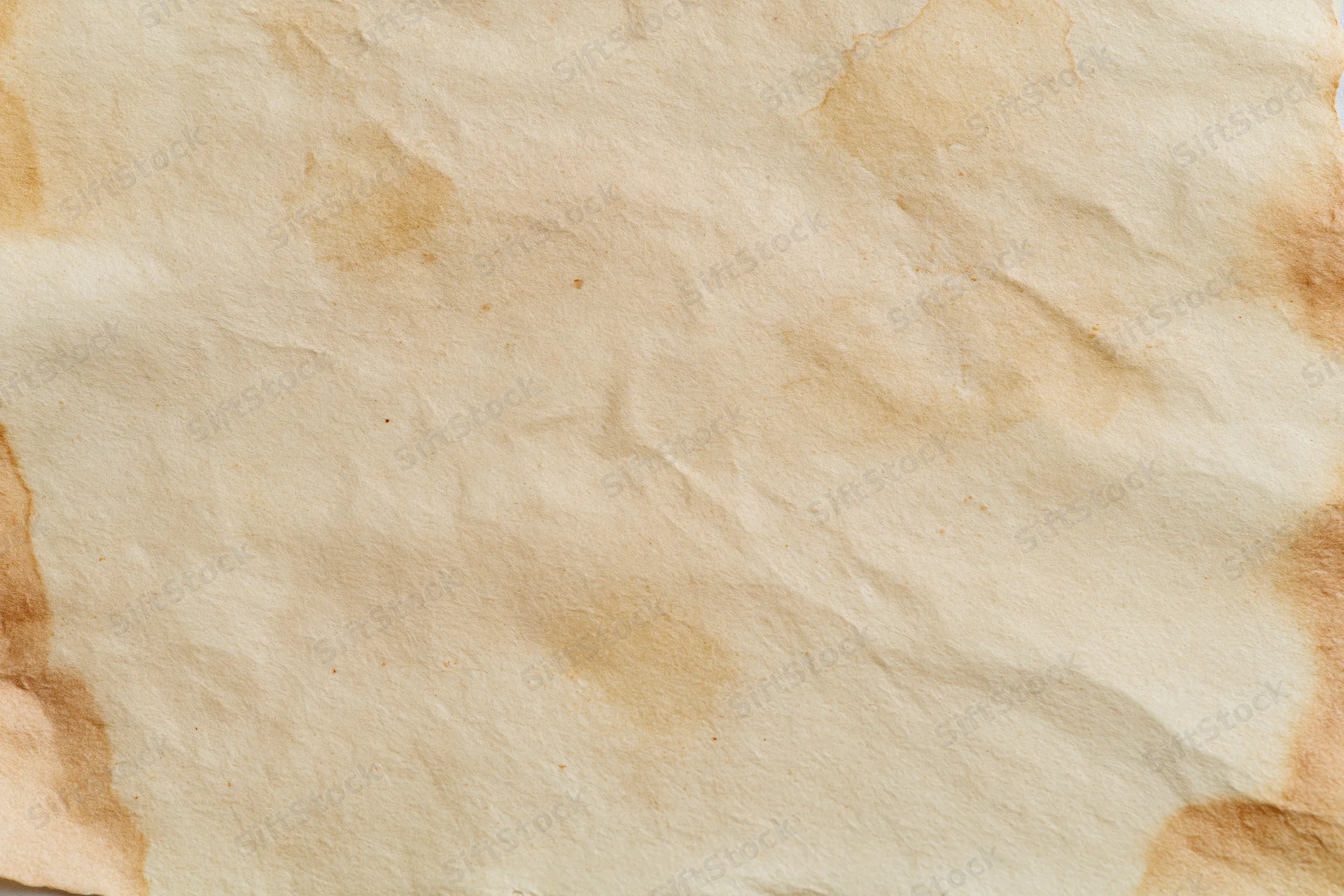 Aged paper sheet with crumpled texture and brown stains filling the frame