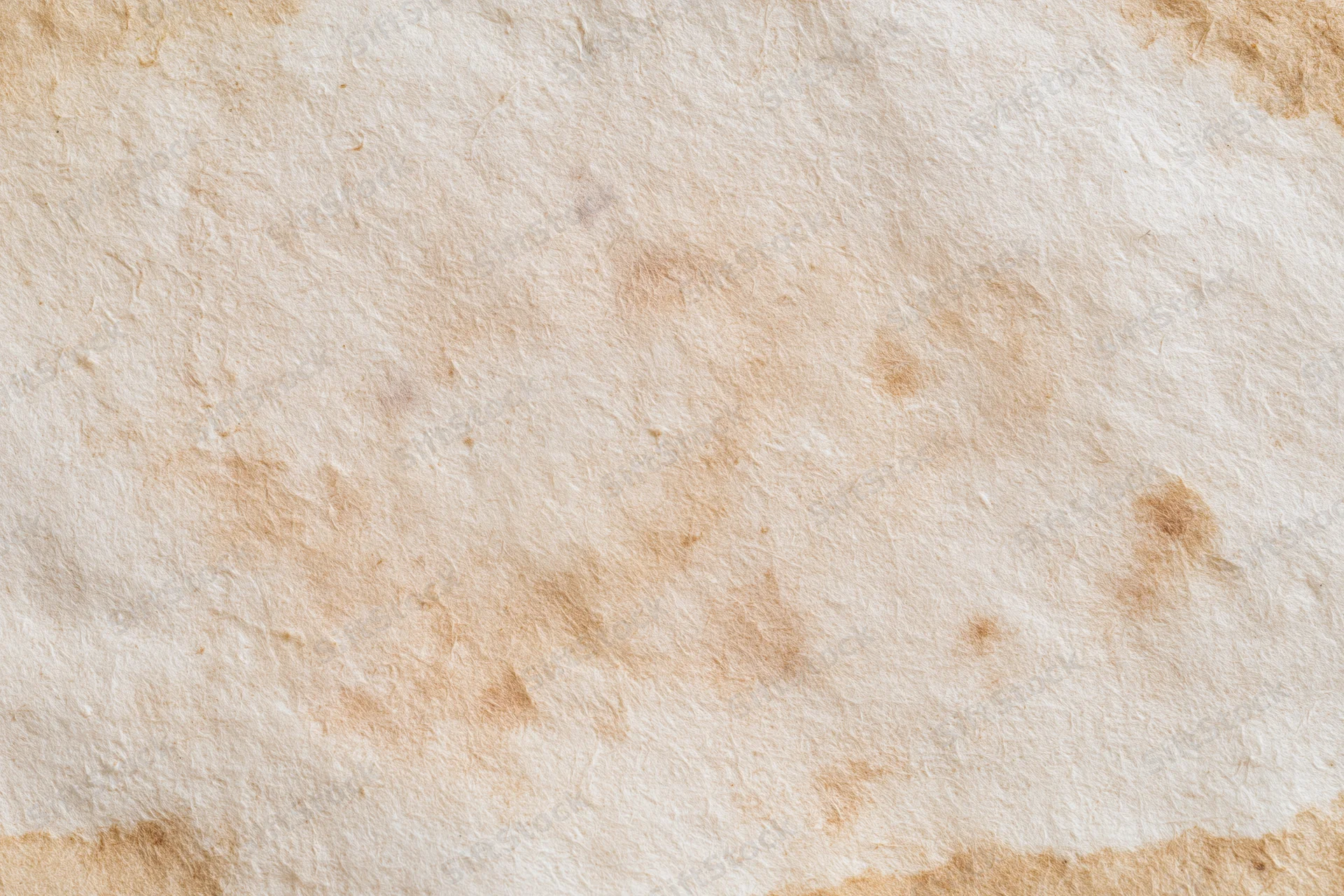 Close-up flat lay of a single sheet of aged paper filling the frame