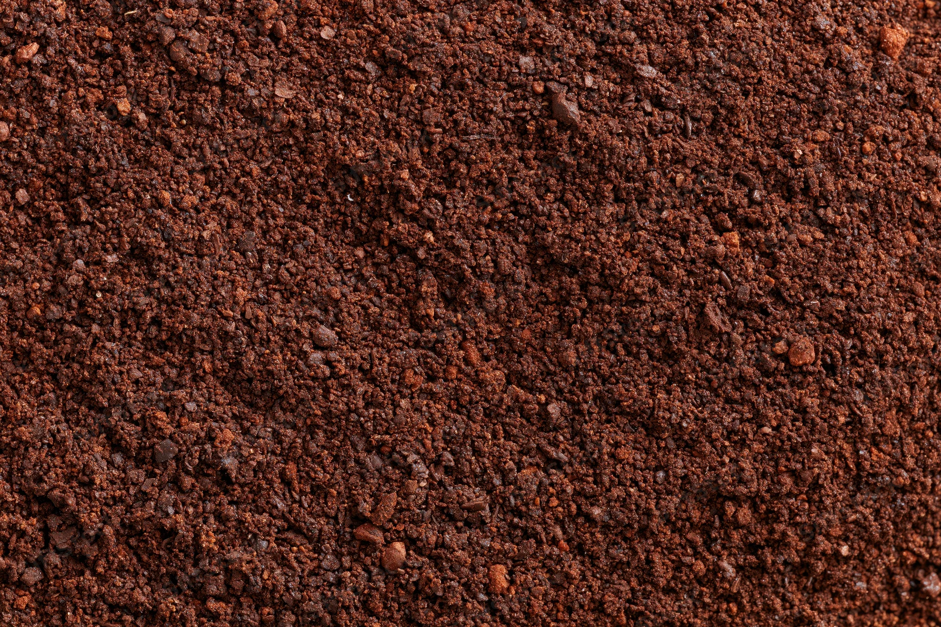 Finely ground coffee filling the frame in a flat lay close-up view