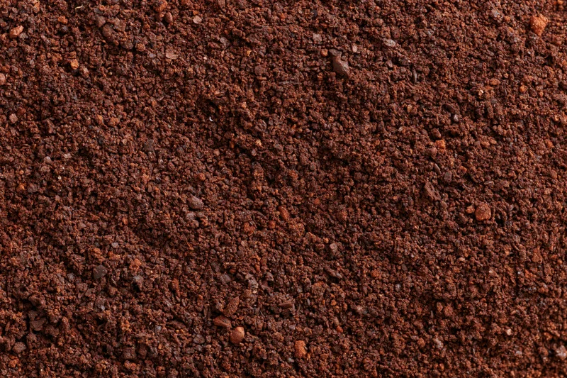 Finely ground coffee filling the frame in a flat lay close-up view