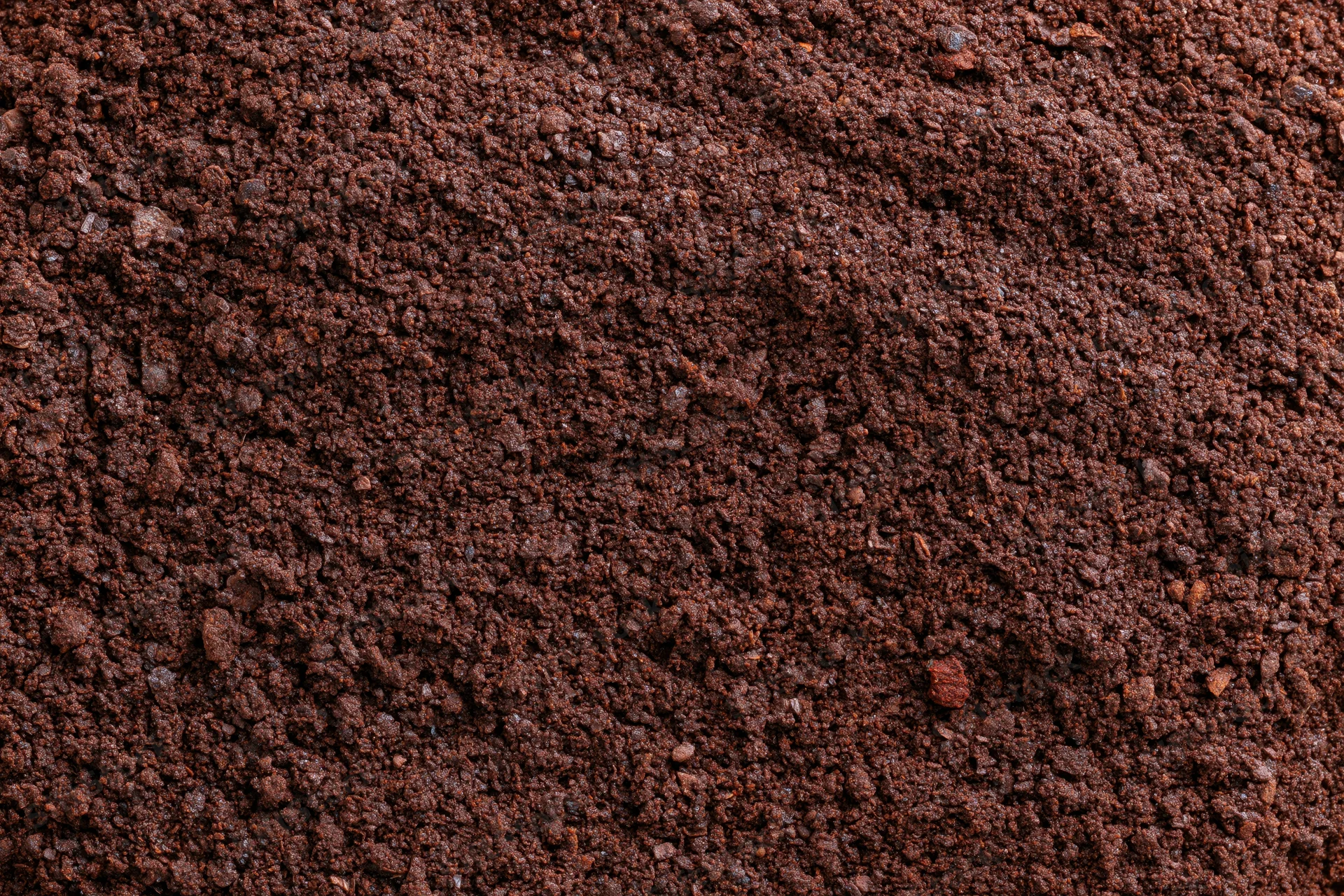 Finely ground coffee spread in a flat lay filling the frame