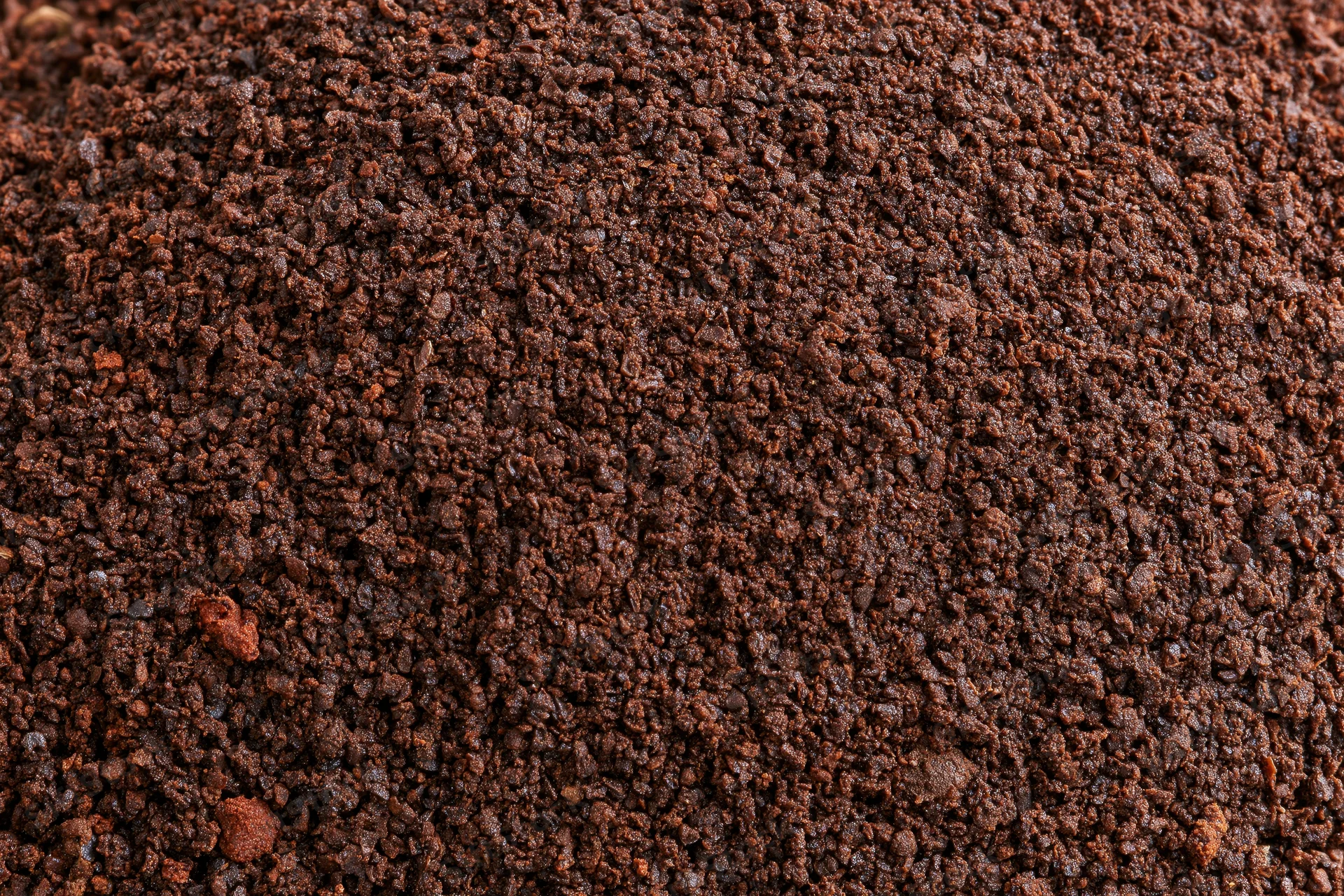 Finely ground coffee filling the frame in a flat lay close-up view