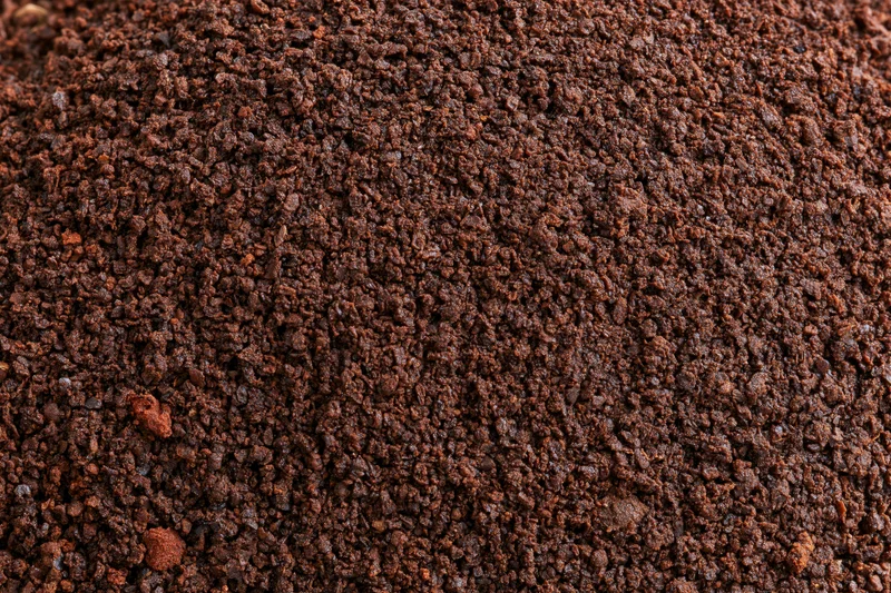 Finely ground coffee filling the frame in a flat lay close-up view
