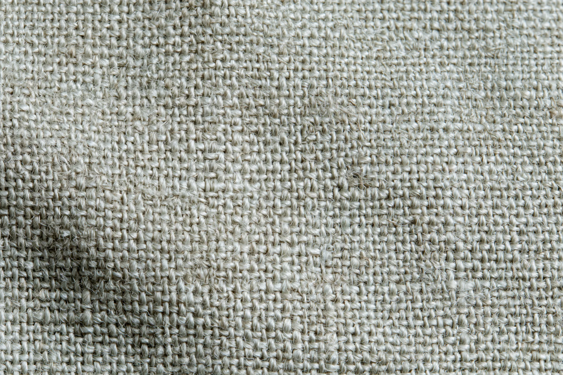 Close-up flat lay of woven linen fabric filling the frame