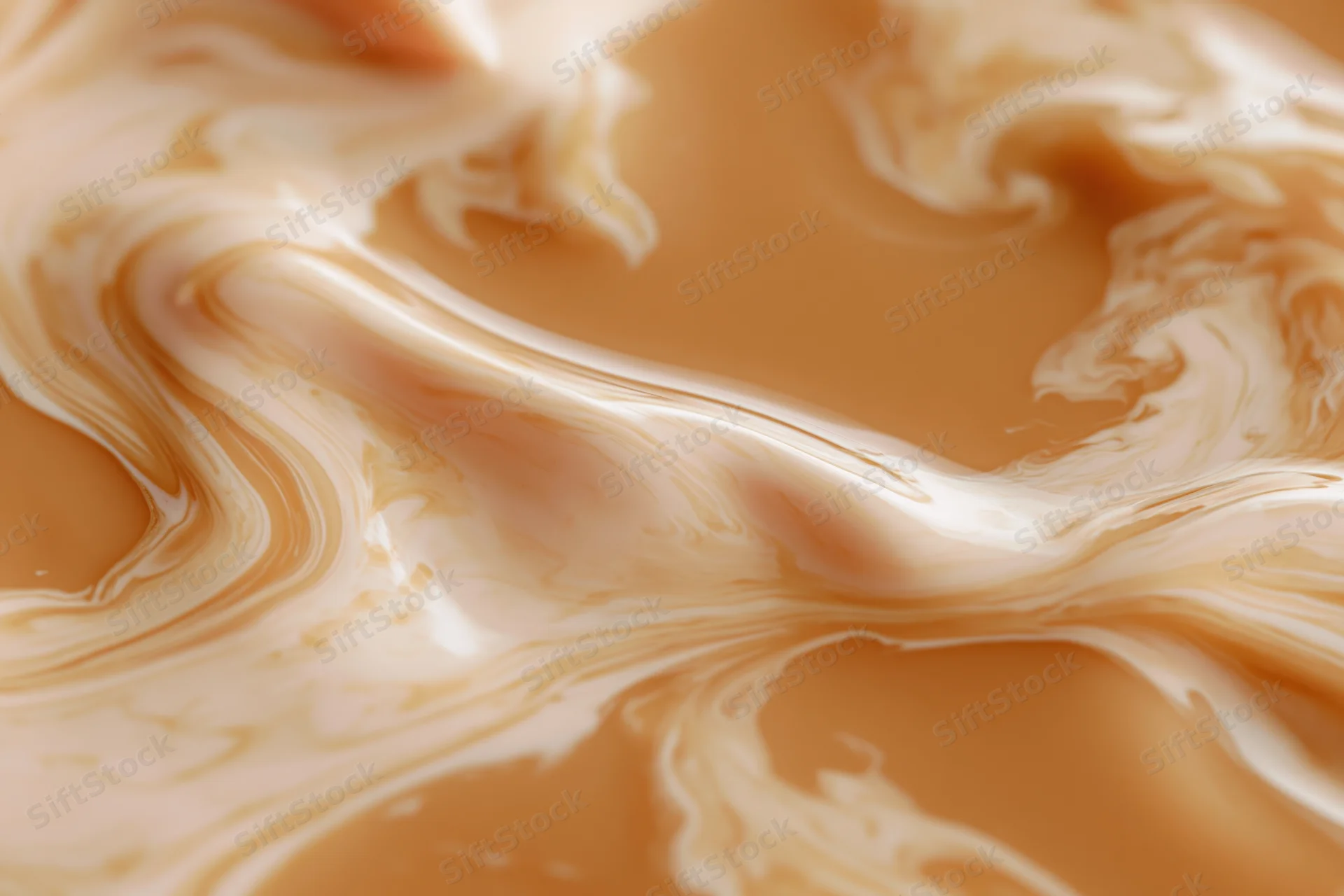 Cream swirling into warm caramel in a close-up macro view