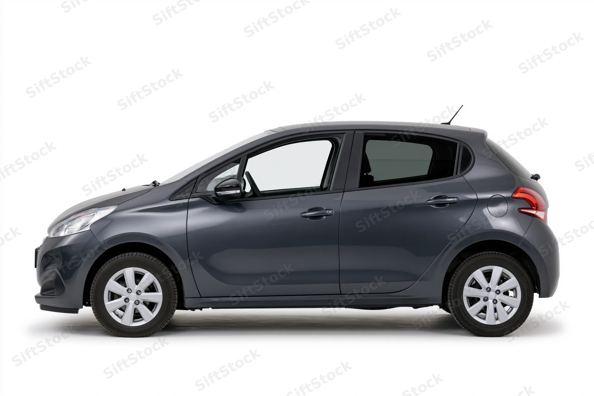Dark grey compact hatchback car shown in clean side profile view against white background