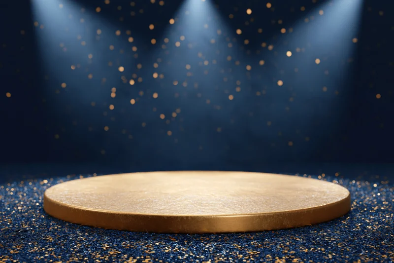 Golden circular podium on glittering navy blue floor under spotlights