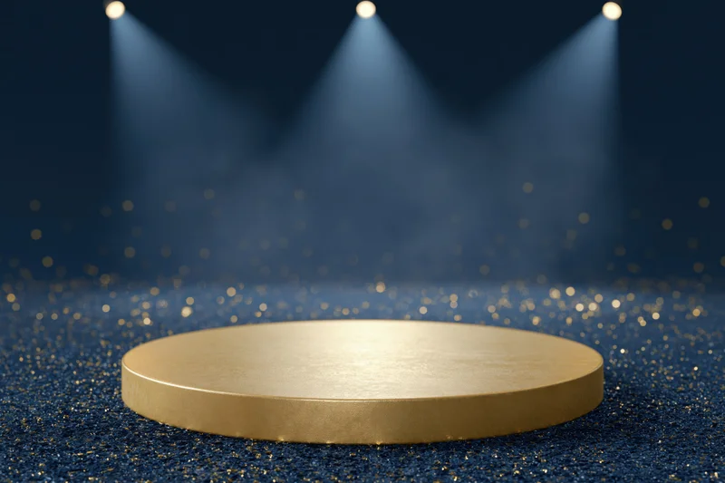 Golden circular podium under spotlights on glittering navy blue floor