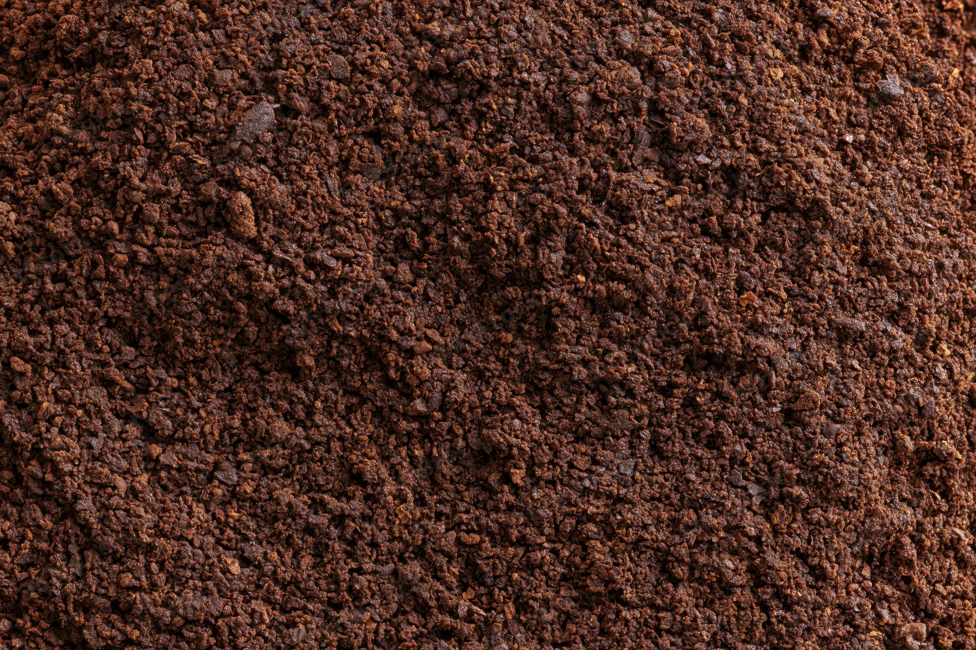Ground coffee filling the frame in extreme closeup macro view
