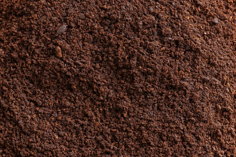 Ground coffee filling the frame in extreme closeup macro view