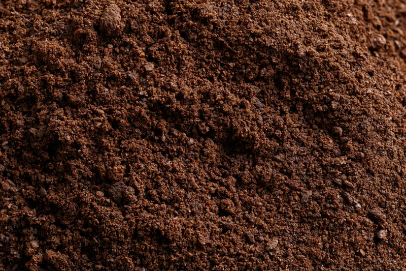 Ground coffee filling the frame in extreme closeup macro view
