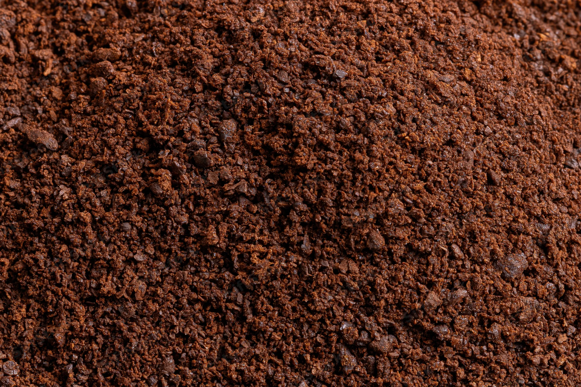 Ground coffee filling the frame in extreme close-up macro view