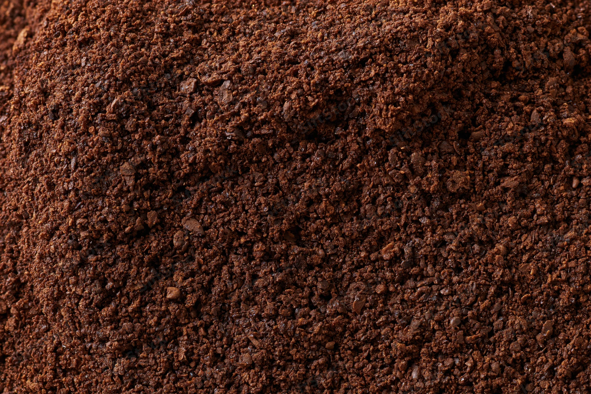 Ground coffee filling the frame in extreme closeup macro view