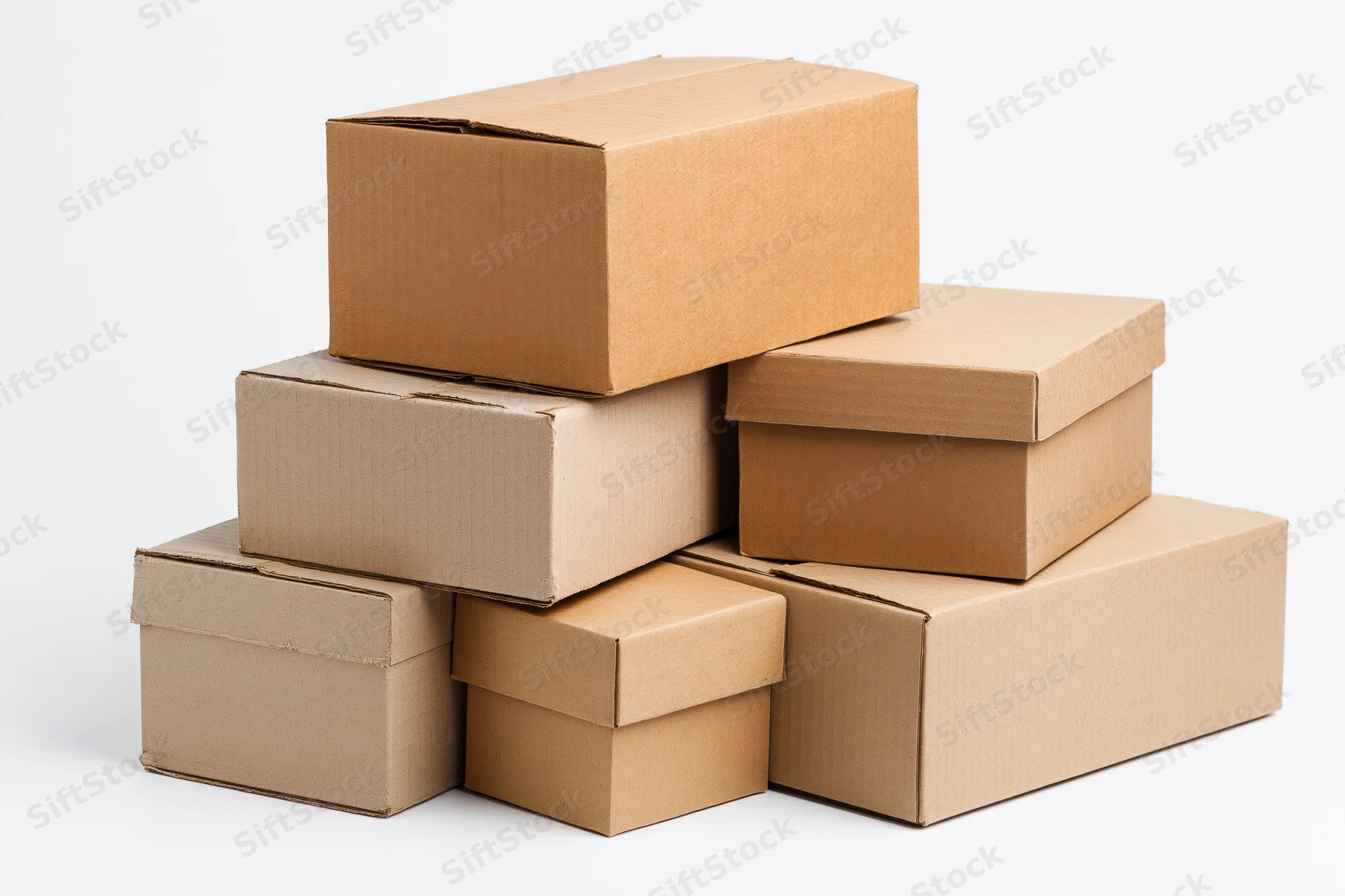 Stack of plain cardboard boxes of varying sizes arranged in a pyramid shape on a white background