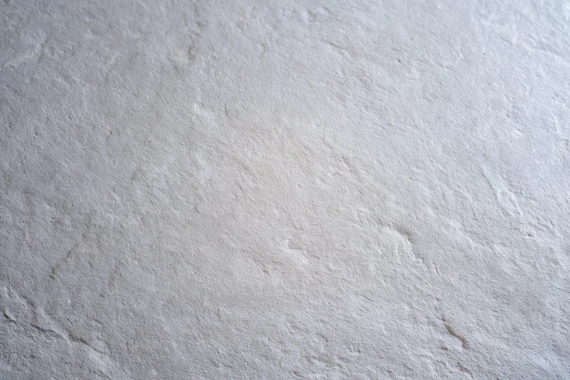 Flat bare concrete wall surface filling the entire frame