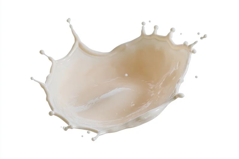 Milk splash forming a crown shape frozen mid-air against a pure white background