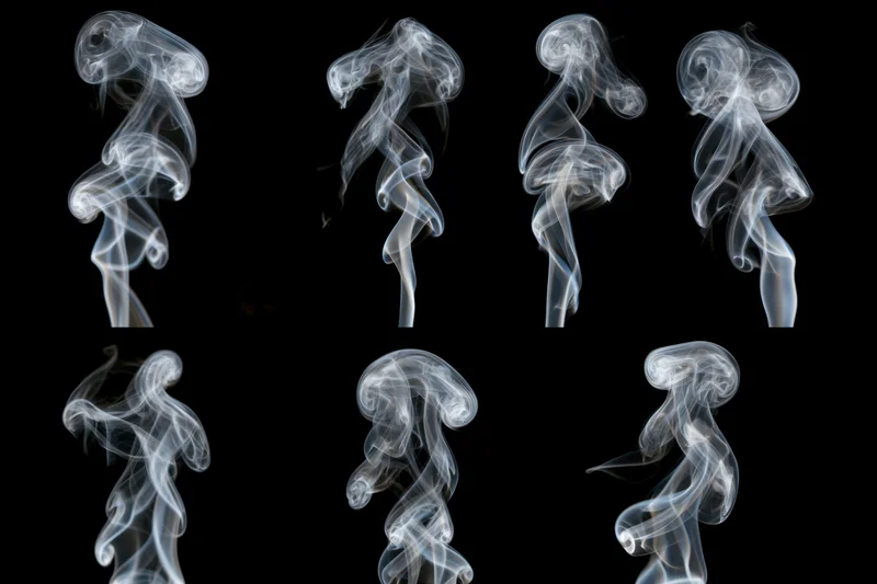 White smoke wisps arranged in a grid pattern against a black background