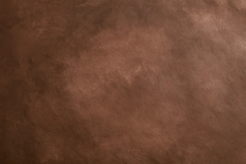Plain matte brown surface filling the frame in close-up view