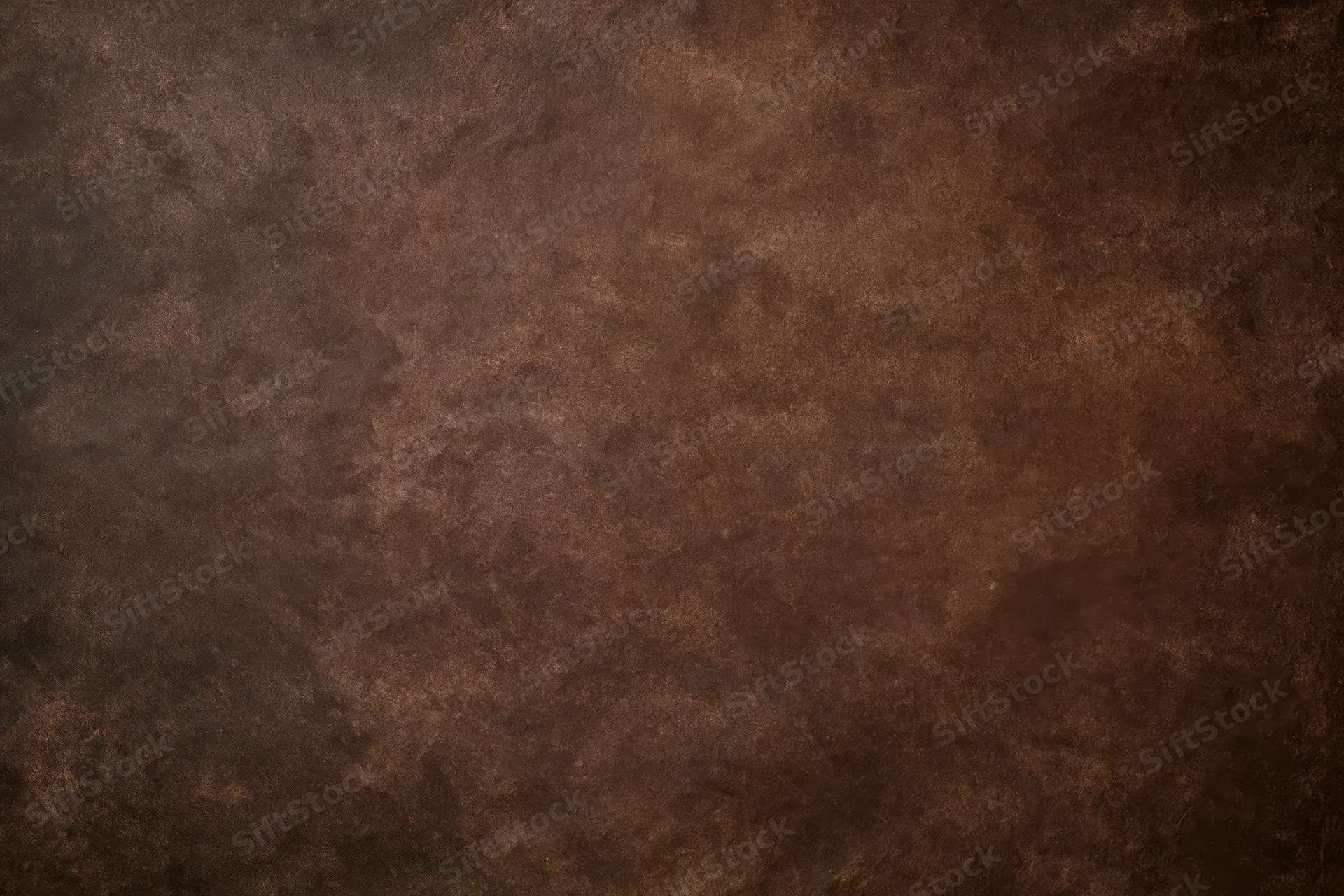 Plain mottled brown studio backdrop texture with no subject