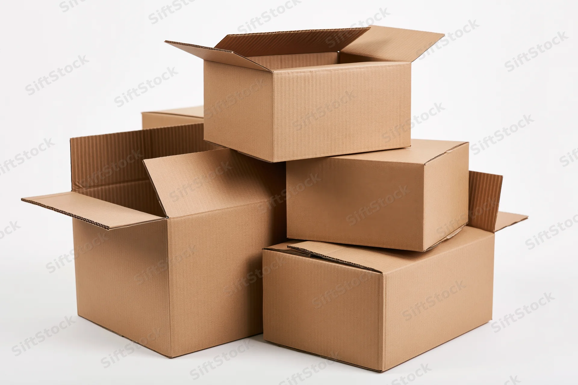 Cardboard moving boxes stacked and arranged in a loose pile on a white background