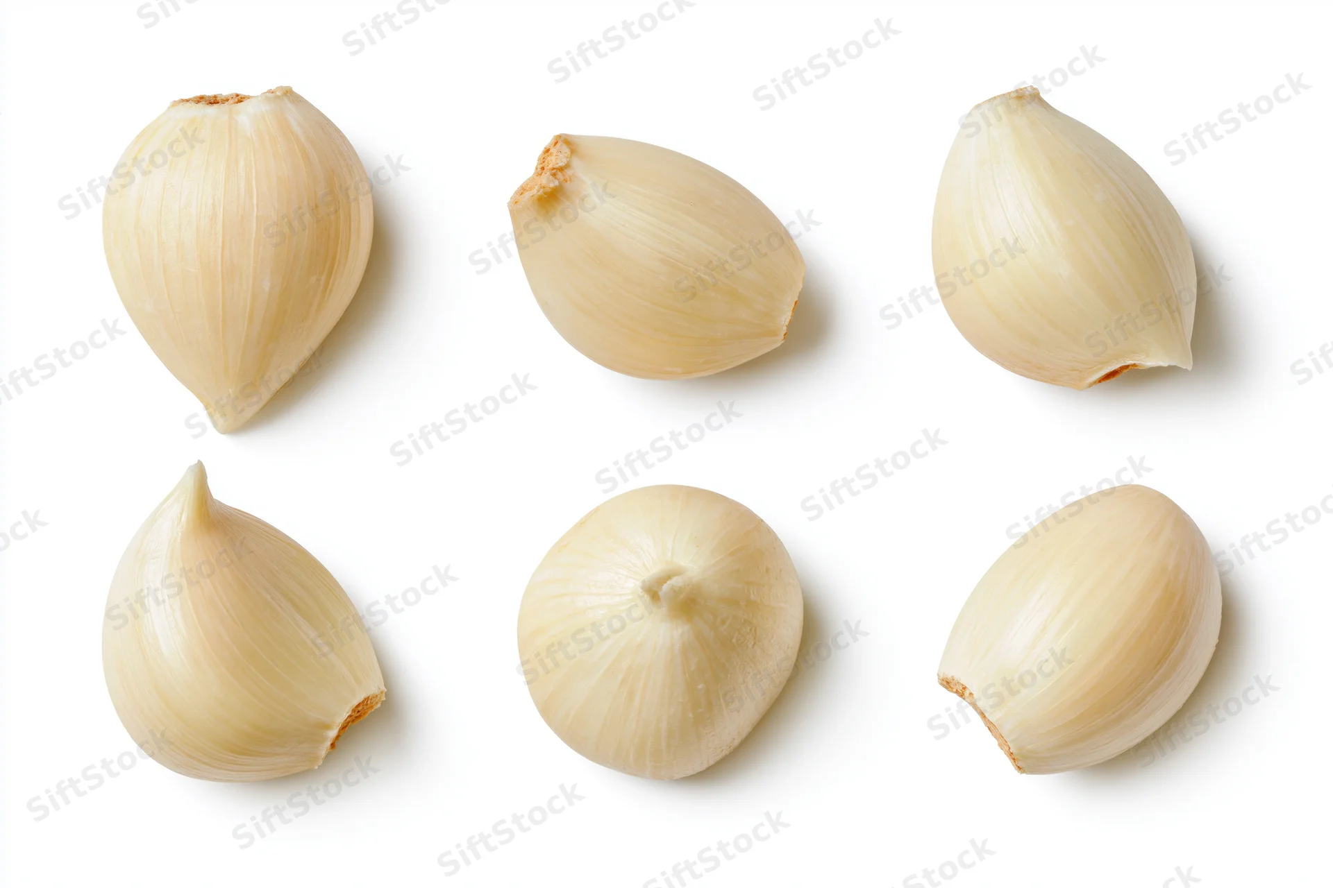Six peeled garlic cloves arranged in two rows on a white background